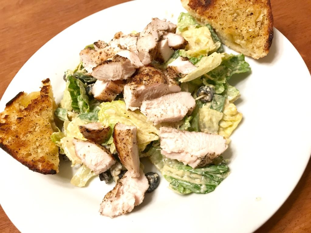 Place on individual plates with chicken and garlic bread. You can also toss the chicken with the dressing if you'd like. Sprinkle a bit more parmesan cheese on top and enjoy! 